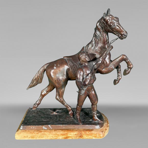 Sculpture of a trainer and his horse, regula with brown patina-0