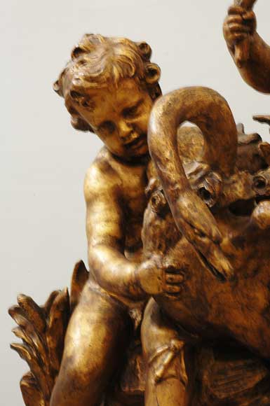 Gilded garden fountain with putti and swan