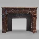 Regence style mantel in Rouge du Nord marble