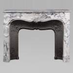 Louis XV style Arabescato marble mantel adorned with an asymmetrical palmette