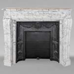 Louis XVI style mantel with curved entablature decorated with macaroons in Arabescato marble