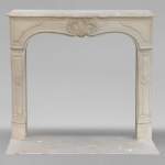 Louis XV style mantel adorned with a carved stone palmette