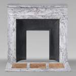 Round Louis XVI style mantel in veined Arabescato marble adorned with a sunflower