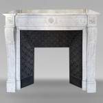 Louis XVI style mantel in Carrara marble adorned with a sunflower