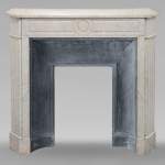 Carved Carrara marble Louis XVI mantel with canted corners