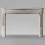 Slightly curved Louis XVI style mantel carved in stone