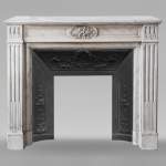 Louis XVI style Carrara marble mantel with filleted flutes and acanthus leaves