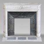 Round Louis XVI style mantel in Carrara marble adorned with a laurel wreath