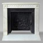 Louis XVI style mantel in semi-statuary marble adorned with a Greek frieze
