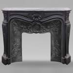 Louis XV style mantel with carved shell in fine black marble