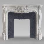Louis XV style mantel in veined Carrara marble