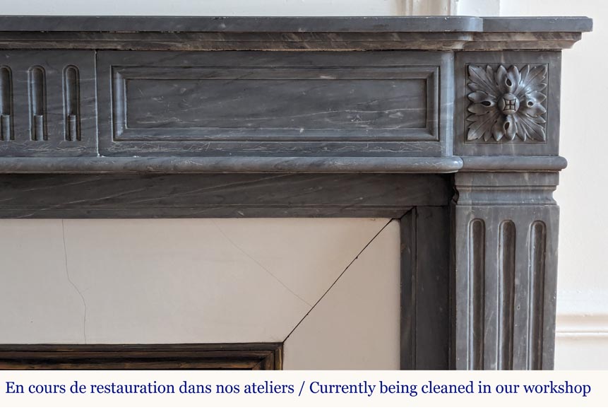 Louis XVI style mantel with curved flutes adorned with rosettes carved in Turquin marble-6