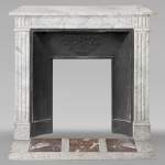 Louis XVI style mantel in veined Carrara marble with fluting