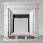 Louis XVI style mantel in veined Carrara marble with flower adorned heads