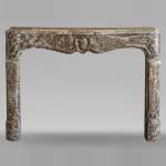 Louis XV period mantel in Rouge du Nord marble