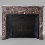 Louis XIV style mantel with acroterion in Rouge du Nord marble