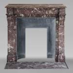 Napoleon III style mantel with modillions in Rouge du Nord marble