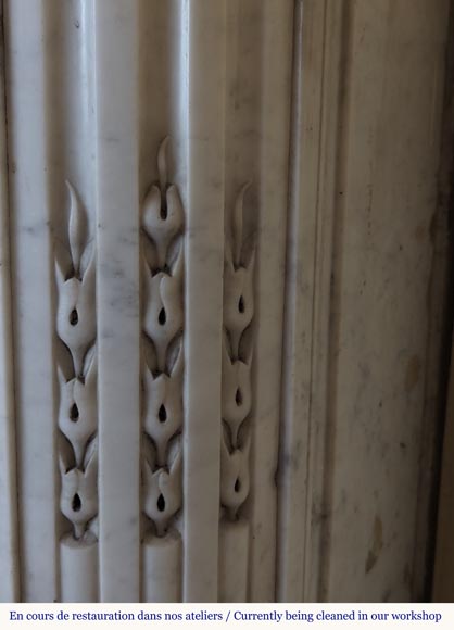 Louis XVI style Carrara marble mantel with rounded corners adorned with a sunflower flower-9