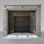 Louis XVI style Turquin marble mantel adorned with bronze sunflowers