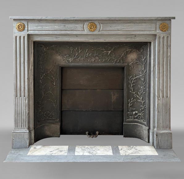 Louis XVI style Turquin marble mantel adorned with bronze sunflowers-0