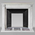 Louis XVI style mantel in veined Carrara marble adorned with rosettes