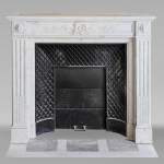 Louis XVI style mantel in Carrara marble adorned with a laurel wreath