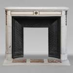 Louis XVI style mantel with rounded corners in statuary marble decorated in bronze