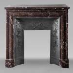 Louis XIV style mantel in Rouge du Nord marble