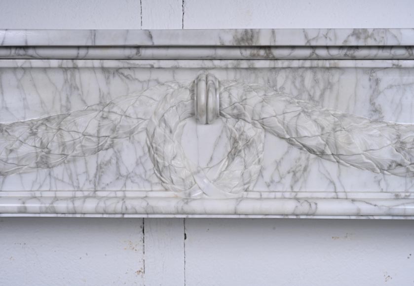 Louis XVI period mantel adorned with a garland carved in antique veined Carrara marble-1