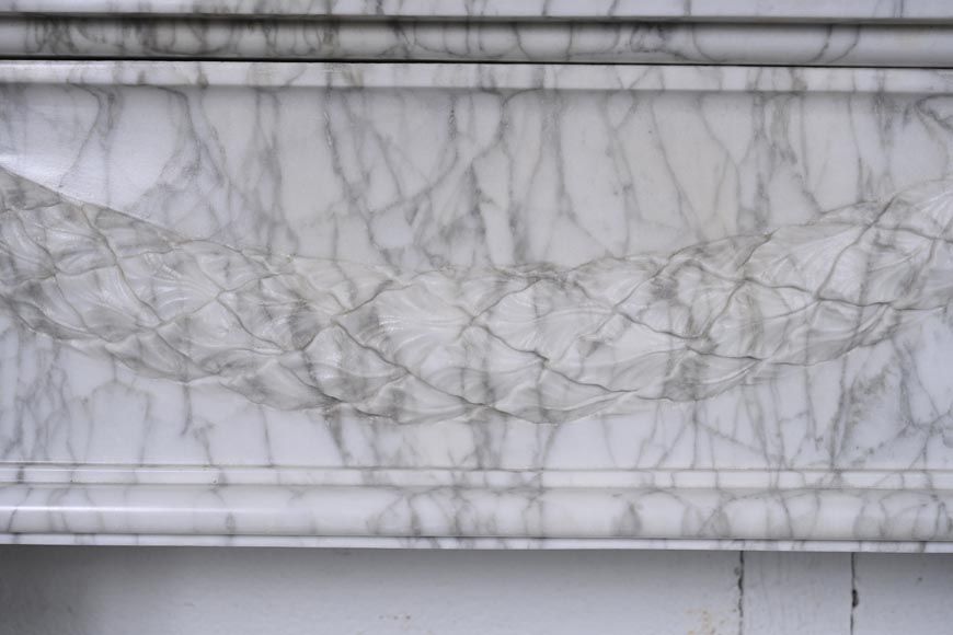 Louis XVI period mantel adorned with a garland carved in antique veined Carrara marble-3