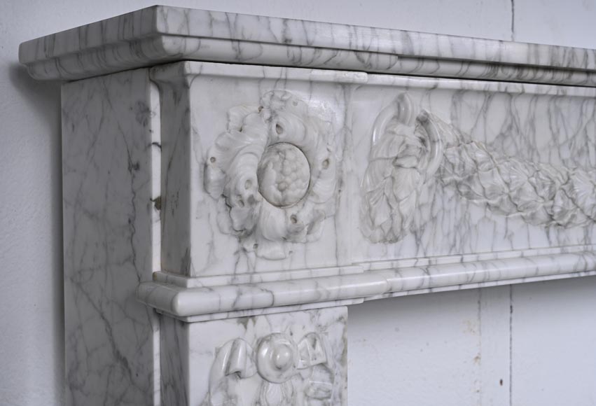 Louis XVI period mantel adorned with a garland carved in antique veined Carrara marble-6