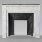 Louis XVI style mantel in semi-statuary marble decorated with curved flutes