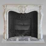 Louis XV style mantel in Carrara marble with richly carved palmette motif