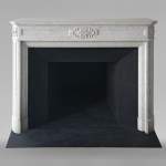 Louis XVI style mantel with rounded corners carved in Carrara marble