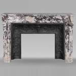 Louis XVI style curved mantel in Breche violette decorated with a Greek frieze