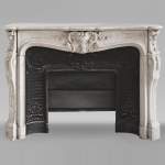 Louis XV style mantel in highly carved Carrara marble