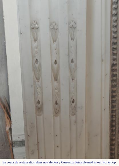 Louis XVI style semi-statuary marble mantel adorned with a frieze of flowers-4