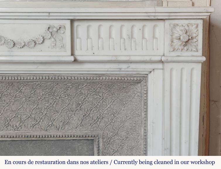 Louis XVI style semi-statuary marble mantel adorned with a frieze of flowers-7