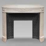 Louis XVI style curved mantel decorated with a laurel wreath