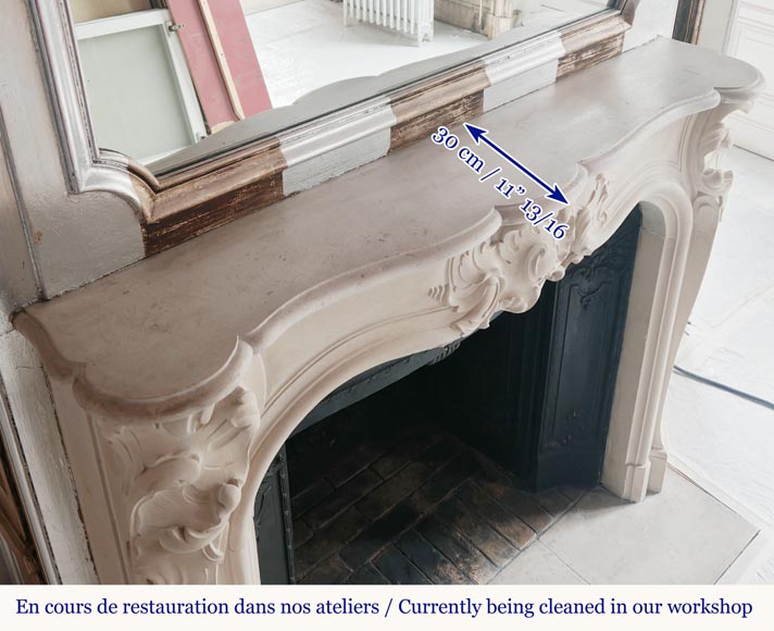 Louis XV style stone mantel with asymmetrical shell design-11