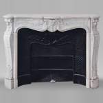 Louis XV style fireplace in Carrara marble decorated with a shell